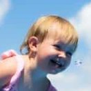 Happy child playing in a Cosmo pool